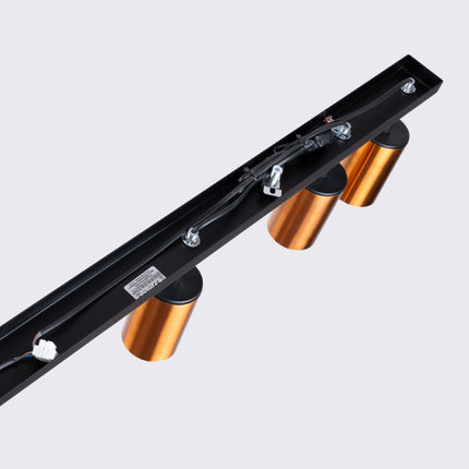 Détail des spots cuivrés du Plafonnier Acier Luxe 6 Barre, gros plan