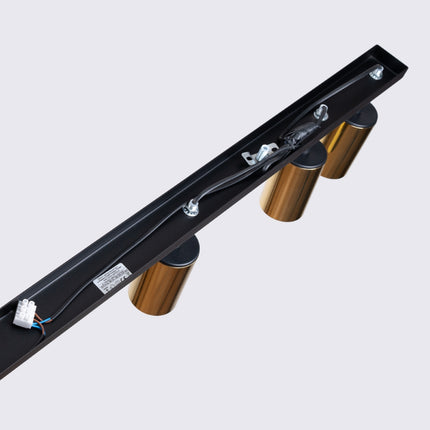 Détail des spots dorés du Plafonnier Acier Luxe 6 Barre, gros plan
