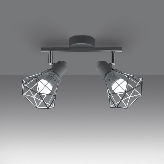 Détail de la douille E14 et de la rotule chromée orientable du plafonnier blanc