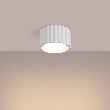 Matte white Aura 1 ceiling light mounted on the ceiling, warm and discreet light diffusion