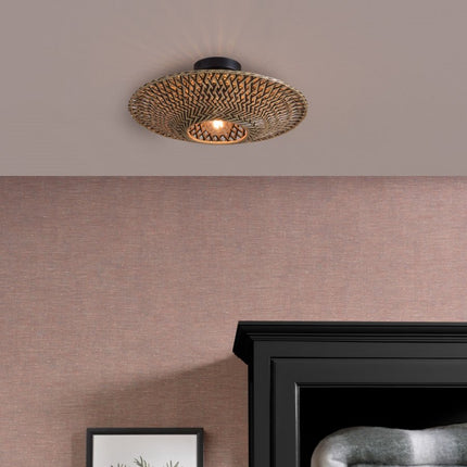 Bali ceiling light in braided black and natural bamboo installed on the ceiling of a bedroom, Japandi atmosphere