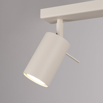 Plafonnier Barre 4 Spots Orientables Beige, vue sur fond coloré