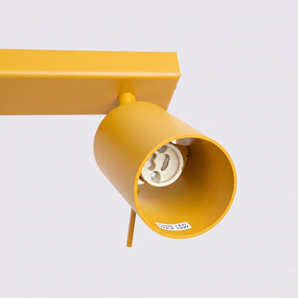 Plafonnier Barre 4 Spots Orientables Jaune Ambré, packshot de trois quarts