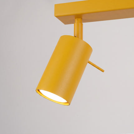 Plafonnier Barre 6 Spots Orientables Jaune Ambré, vue sur fond coloré