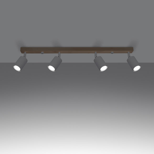Gros plan sur un spot orientable en acier blanc fixé à la barre en bois massif