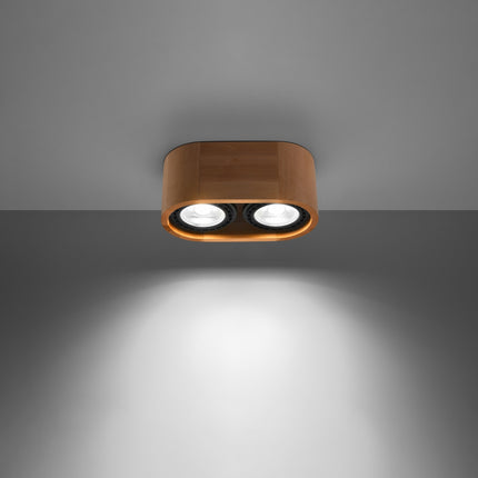 Plafonnier bois naturel double spot allume diffusant une lumiere chaude sur un mur gris