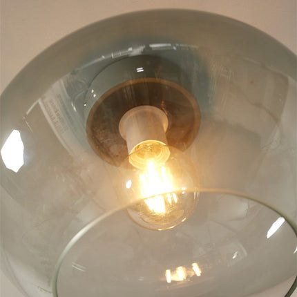 Vue de dessous du plafonnier Bologna montrant l'ampoule et le degrade du verre