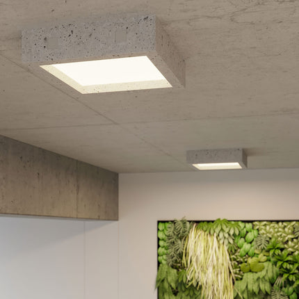 Détail du plafonnier Carré Brut en béton, gros plan sur le diffuseur