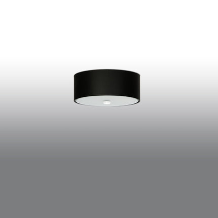 Abat-jour tambour noir du plafonnier Cercle Plein 30 cm, vue légèrement de côté sur fond clair.
