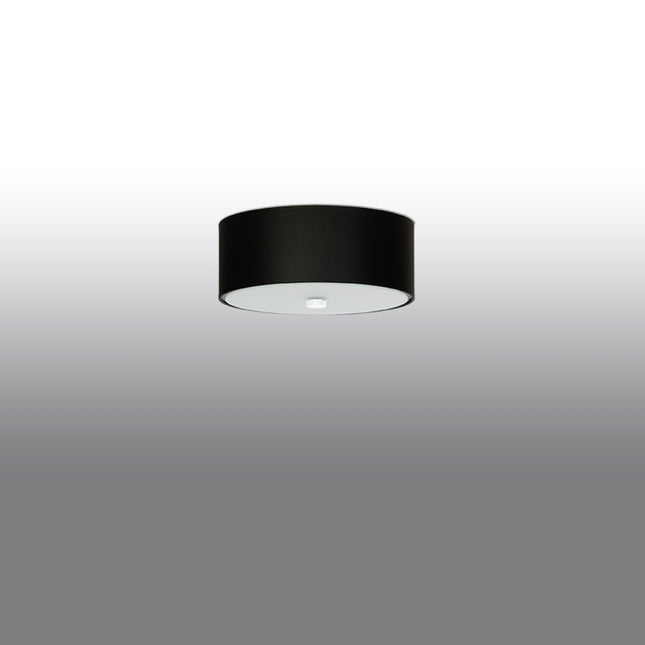 Abat-jour tambour noir du plafonnier Cercle Plein 30 cm, vue légèrement de côté sur fond clair.