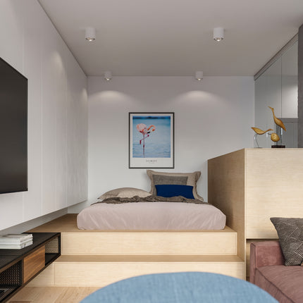 Plafonniers circulaires blancs allumés dans une chambre contemporaine, faisceaux doux sur le mur