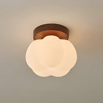 Plafonnier citrouille en bois diffusant une lumière douce dans une chambre
