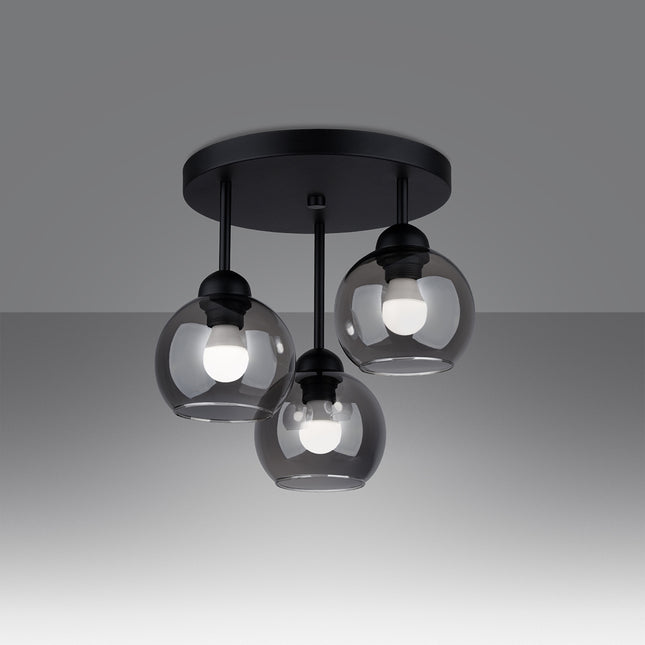 Détail d'un globe en verre fumé soufflé du plafonnier Cloche 3 lumières, effet transparent teinté