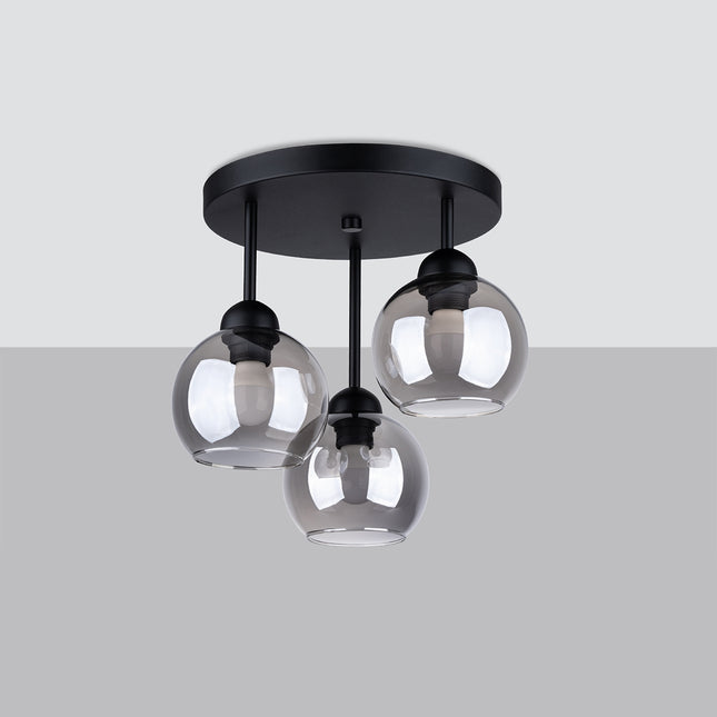 Vue de profil du plafonnier Cloche 3 lumières, globes en verre fumé suspendus à hauteurs différentes