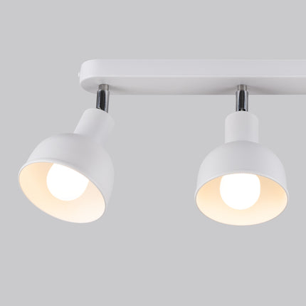 Détail des trois cloches orientables en acier blanc du plafonnier Elba