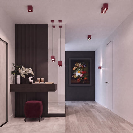 Plafonnier Cube LED bordeaux au-dessus d'un plan de travail