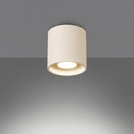 Plafonnier Cylindre LED beige clair allumée, faisceau net