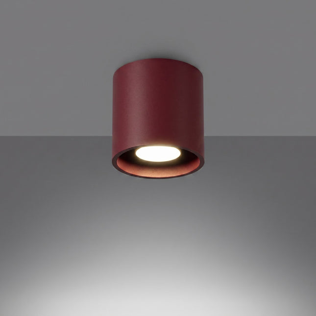 Plafón Cilindro LED burdeos encendido, haz definido