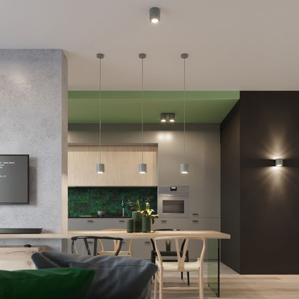 Plafonnier cylindre LED gris créant une ambiance moderne