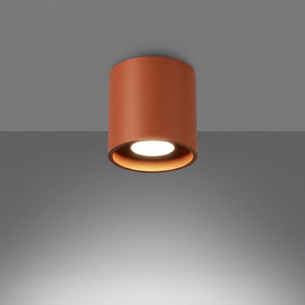 Plafonnier Cylindre LED ocre rouge allumée, faisceau net