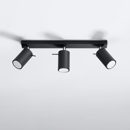 Plafonnier directionnel 3 spots LED noir éclairant un salon