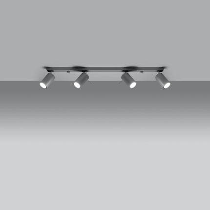 Plafonnier directionnelle 4 spots orientables barre gris installé dans une pièce lumineuse