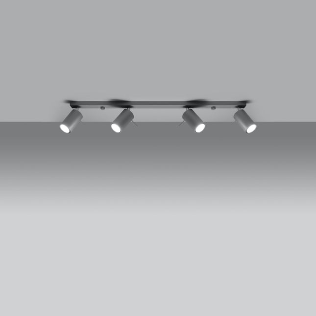 Plafonnier directionnelle 4 spots orientables barre gris installé dans une pièce lumineuse