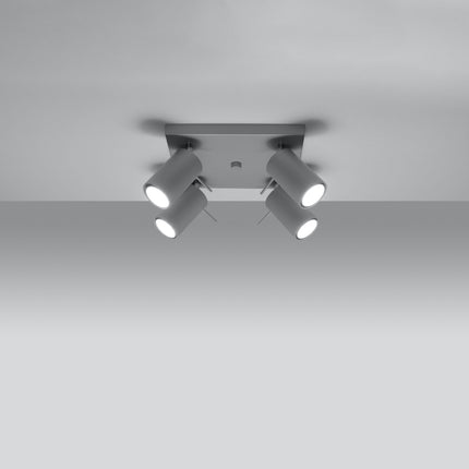 Plafonnier directionnelle 4 spots orientables gris installé dans une pièce lumineuse