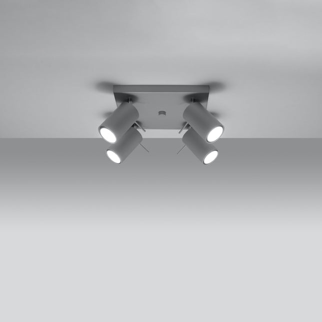 Plafonnier directionnelle 4 spots orientables gris installé dans une pièce lumineuse