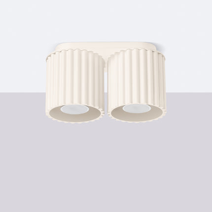 Plafonnier double Aura beige monté au plafond sur fond clair, silhouette à deux cylindres