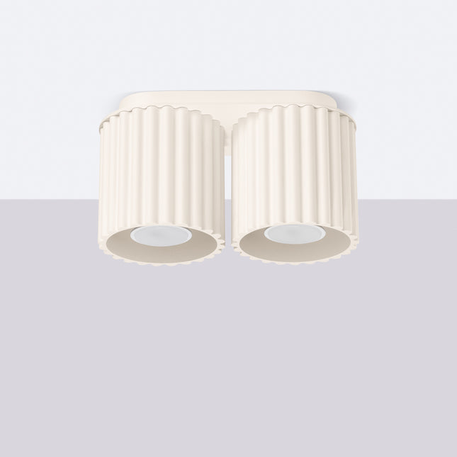 Plafonnier double Aura beige monté au plafond sur fond clair, silhouette à deux cylindres