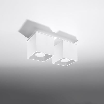 Plafonnier double cube LED blanc au-dessus d'un plan de travail