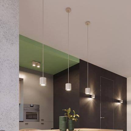 Plafonnier Double Cylindre LED beige clair au-dessus d'un plan de travail