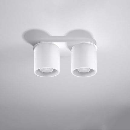 Plafonnier double cylindre LED blanc au-dessus d'un plan de travail