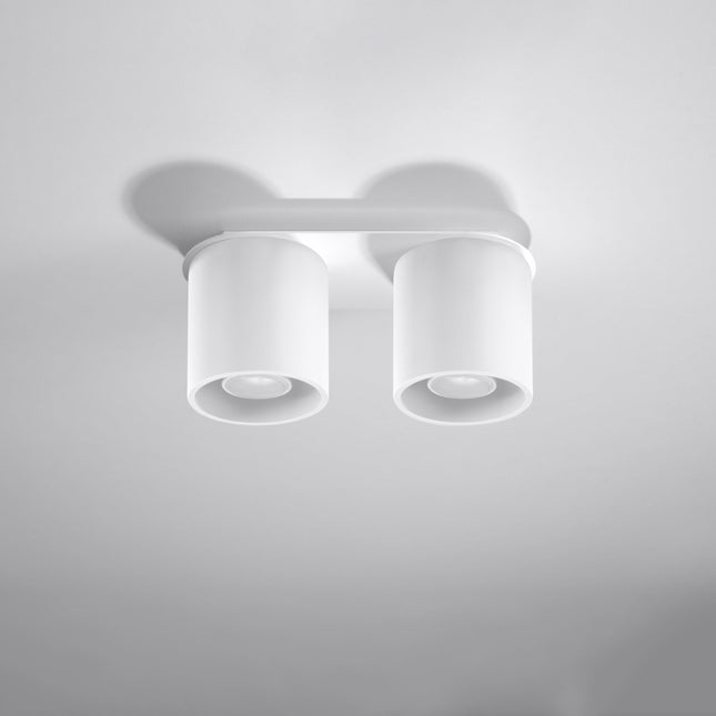 Plafonnier double cylindre LED blanc au-dessus d'un plan de travail