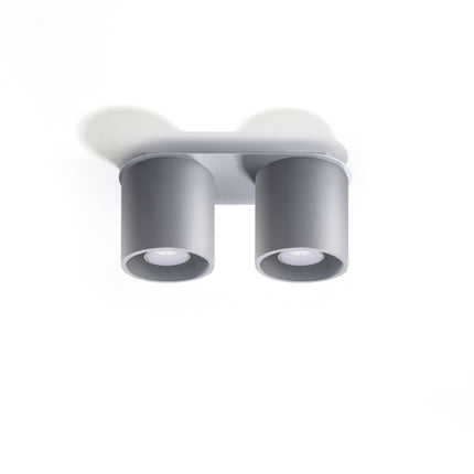 Plafonnier double cylindre LED gris au-dessus d'un plan de travail