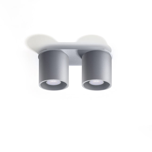 Plafonnier double cylindre LED gris au-dessus d'un plan de travail