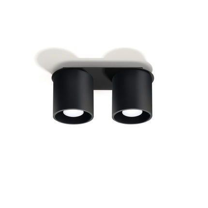 Plafonnier double cylindre LED noir au-dessus d'un plan de travail