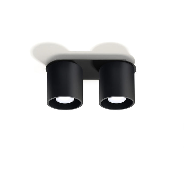 Plafonnier double cylindre LED noir au-dessus d'un plan de travail