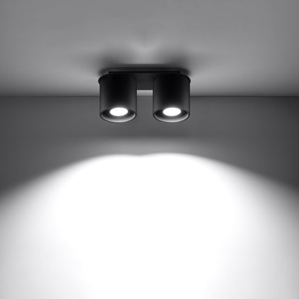 Plafonnier double cylindre LED noir éclairant une entrée
