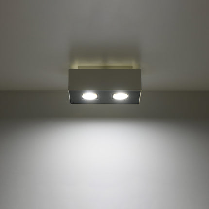 Plafonnier Double Raffiné blanc projetant un faisceau de lumière vers le bas