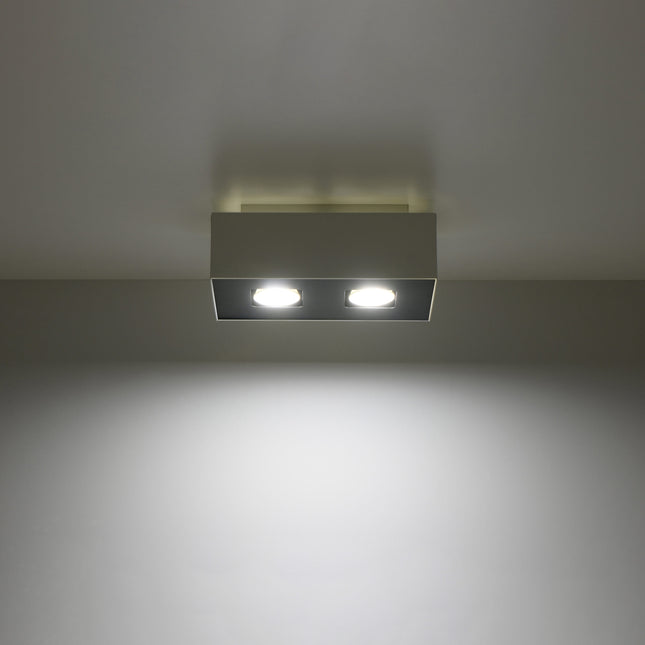 Plafonnier Double Raffiné blanc projetant un faisceau de lumière vers le bas
