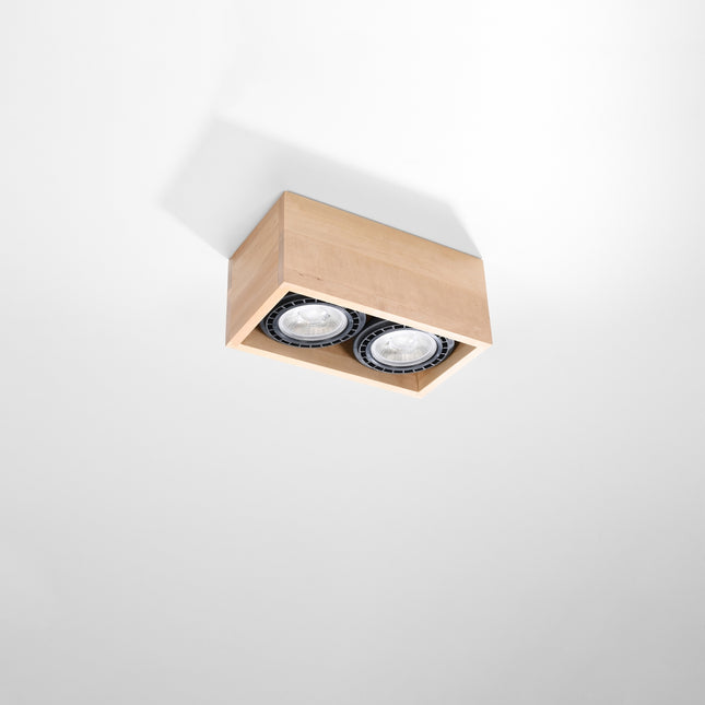 Plafonnier double spot bois naturel monté en saillie sur un plafond blanc