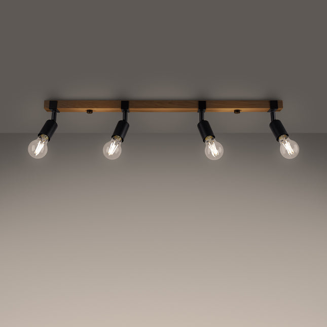 Plafonnier Élégance Bois Noir 4 spots allumé, lumière chaude diffusée par les ampoules à filament