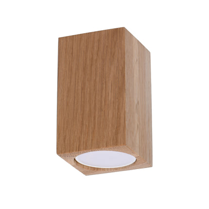 Plafonnier facette cubique en chêne, vue de face, bloc de bois fixé directement au plafond.