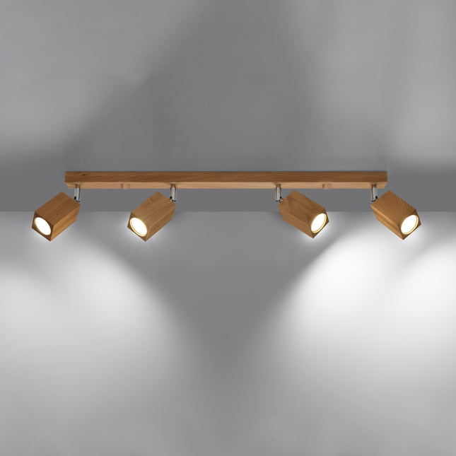 Plafonnier facette cubique en chêne vu de profil, orientation des quatre têtes lumineuses.