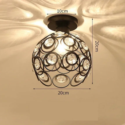 Plafonnier globe en cristal noir allumé, cotes de 20 cm de diamètre et socle de 10 cm