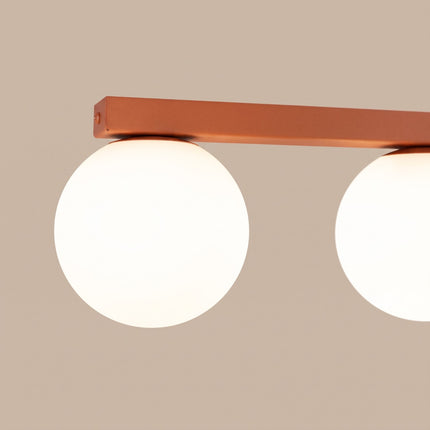 Plafonnier Globe Solis 4 globes ocre rouge, packshot de trois quarts