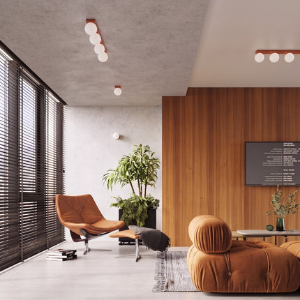 Plafonnier Globe Solis 6 globes ocre rouge dans un salon lumineux aux boiseries claires