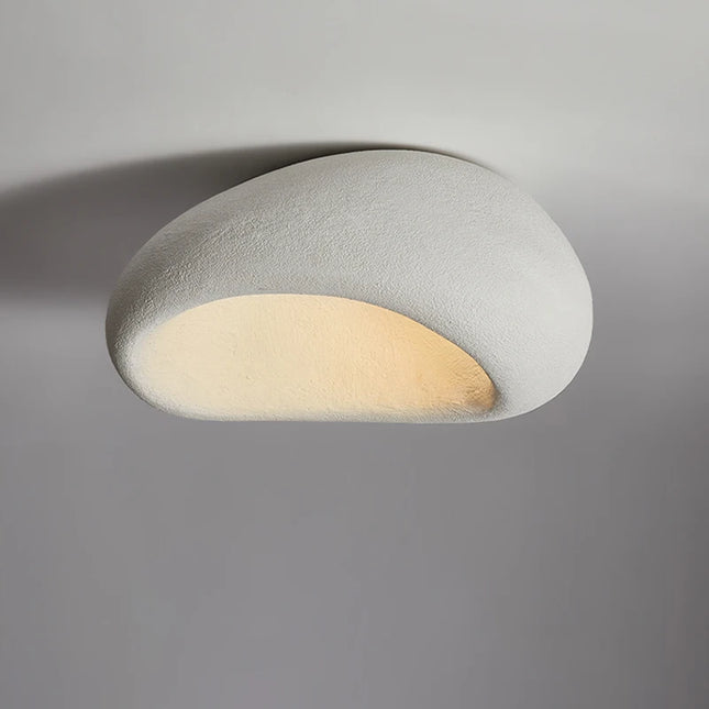 Plafonnier minimaliste japonais en résine, parfait pour une ambiance zen avec un éclairage doux.